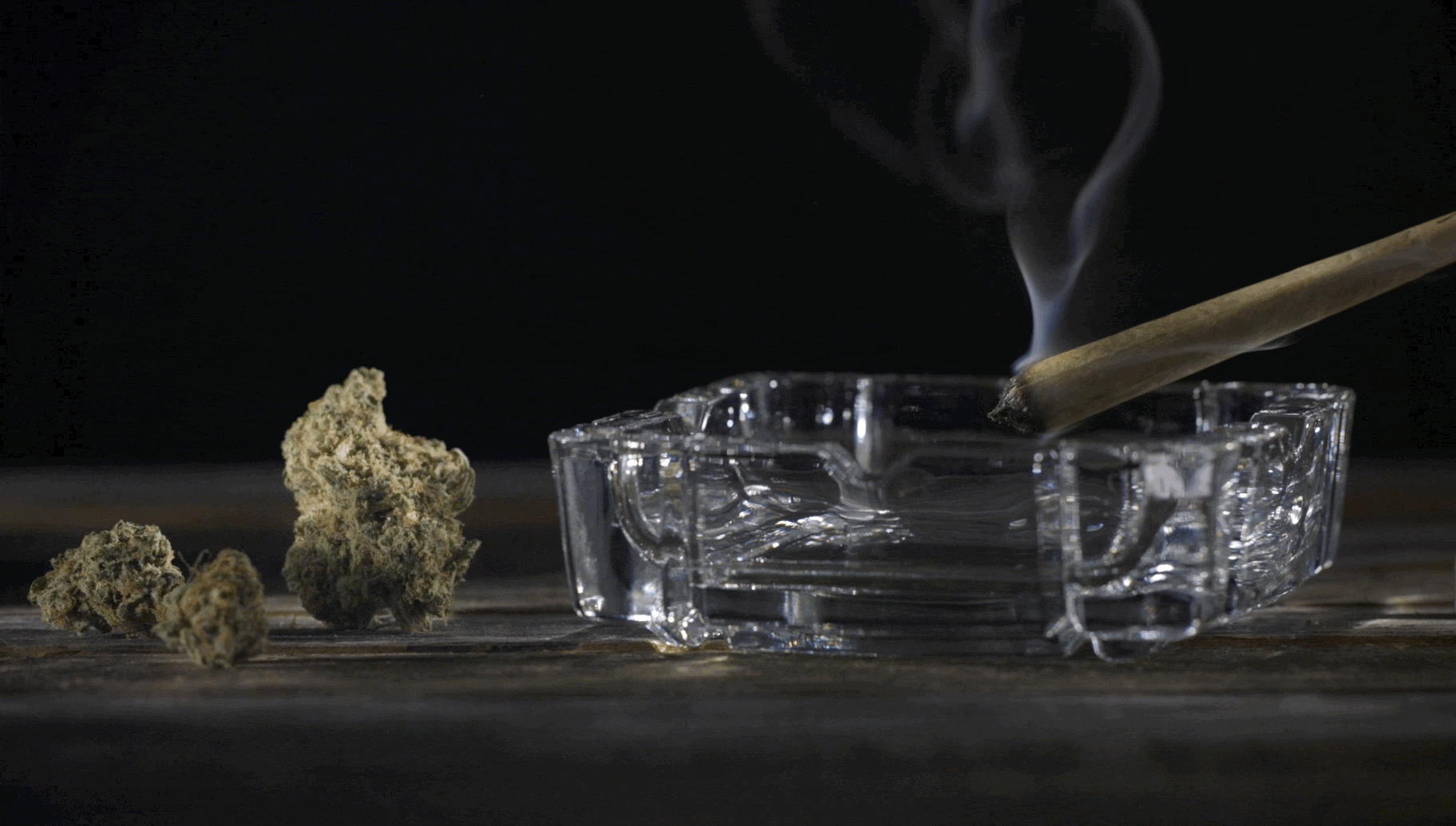 Digital 303 custom designed cinemagraph of a joint in ass tray. Join smoke rising into the air. 